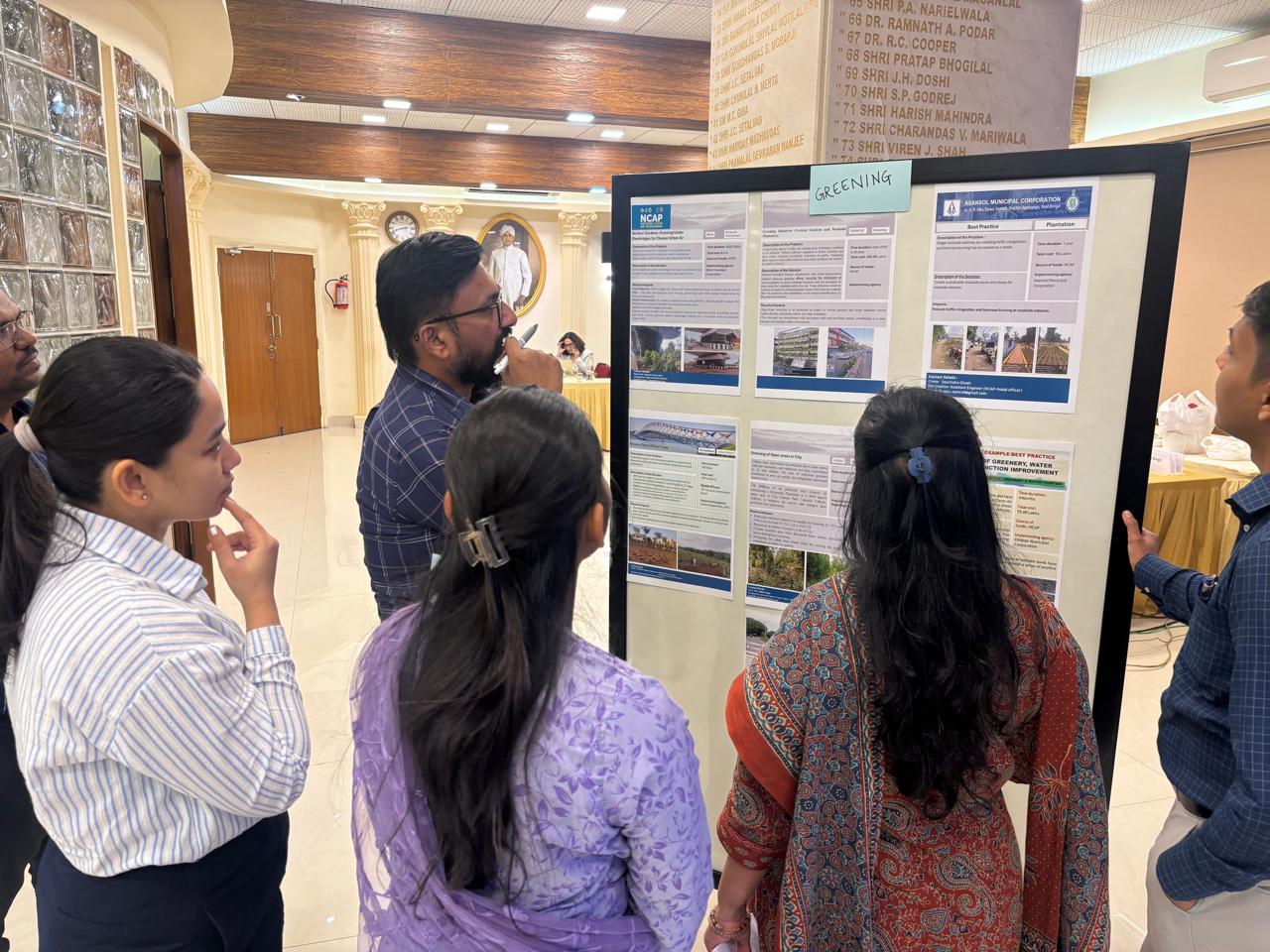 Dust Management Trainees Reviewing Urban Greening Poster Exhibition - iFOREST Past Training Session